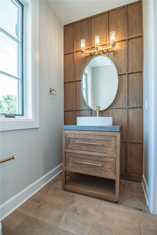 bathroom featuring vanity and hardwood / wood-style flooring