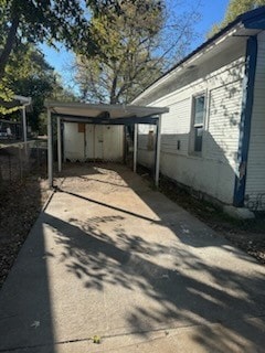 view of home's exterior with a carport