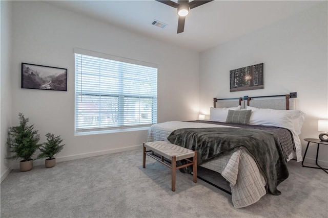 bedroom with light carpet and ceiling fan