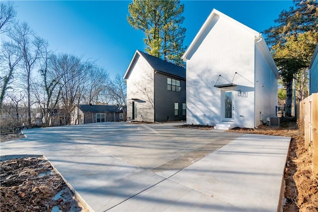 view of home's exterior with central AC unit