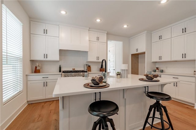 427 E Martin Luther King Jr Blvd, Fayetteville, AR 72701 - kitchen with plenty of natural light, light wood finished floors, stove, and recessed lighting