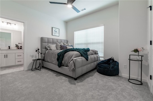 427 E Martin Luther King Jr Blvd, Fayetteville, AR 72701 - bedroom with light carpet, connected bathroom, lofted ceiling, and a ceiling fan