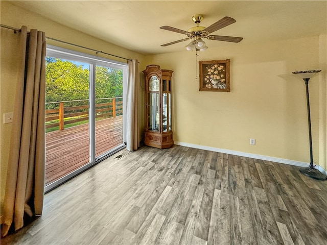 spare room with ceiling fan and hardwood / wood-style floors