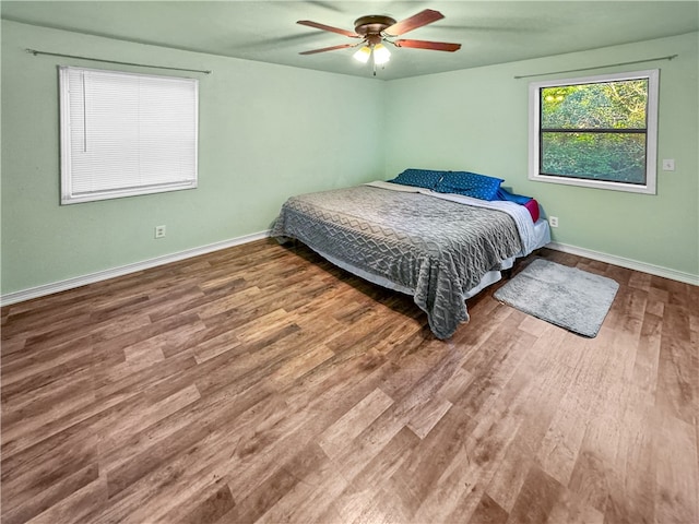 bedroom featuring ceiling fan and hardwood / wood-style flooring