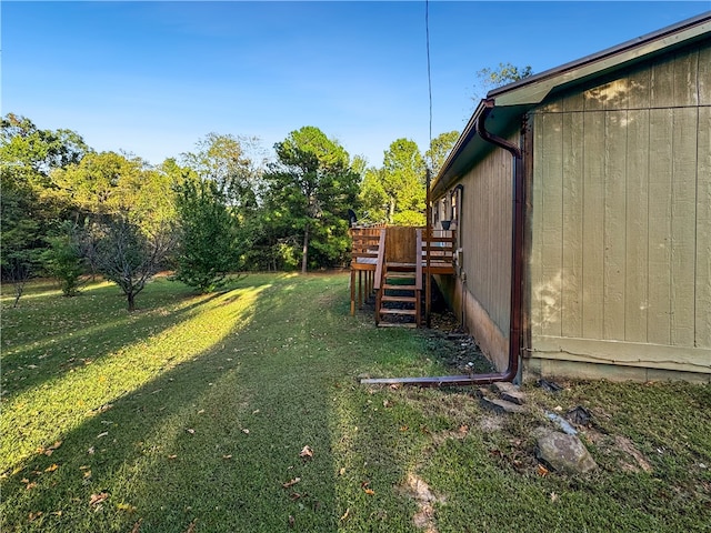 view of yard featuring a wooden deck