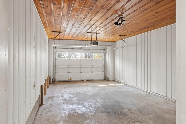 garage with a garage door opener, wood ceiling, and wooden walls