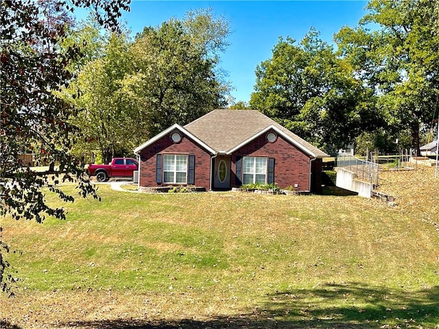 ranch-style home with a front yard