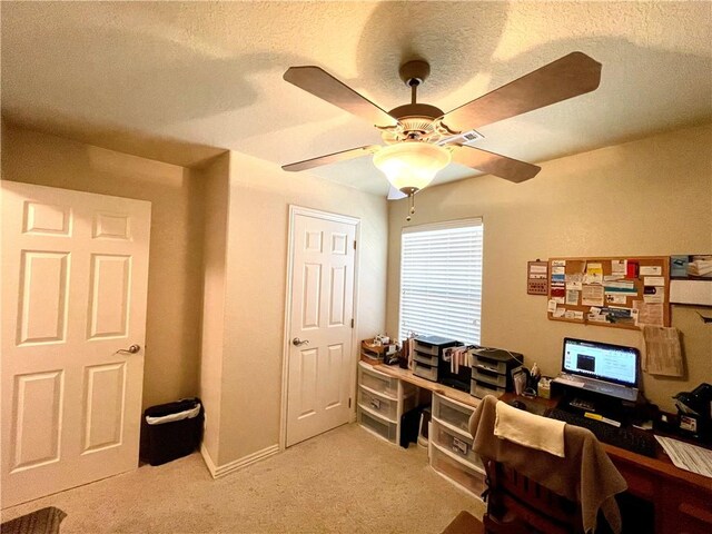 office area featuring light colored carpet and ceiling fan