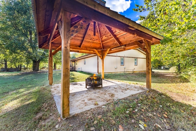 view of patio featuring a gazebo and a fire pit