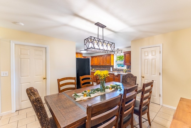 dining space featuring light tile patterned flooring