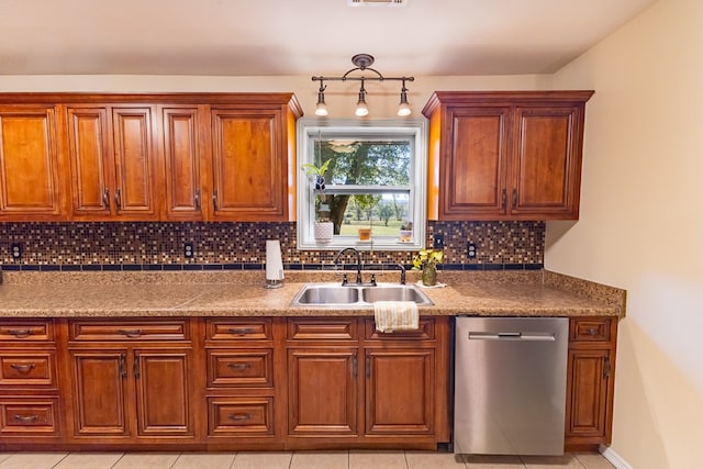 kitchen with sink, light tile patterned floors, decorative backsplash, and dishwasher