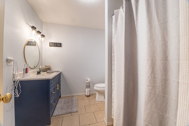 bathroom with vanity, toilet, a shower with shower curtain, and tile patterned flooring