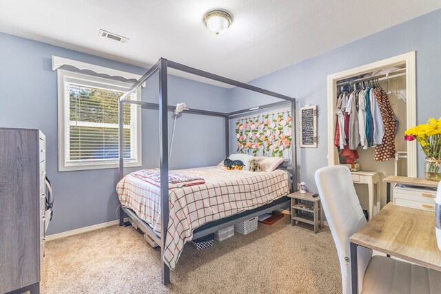 carpeted bedroom with a closet