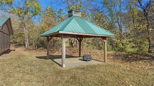 view of home's community featuring a yard, a patio area, and a gazebo