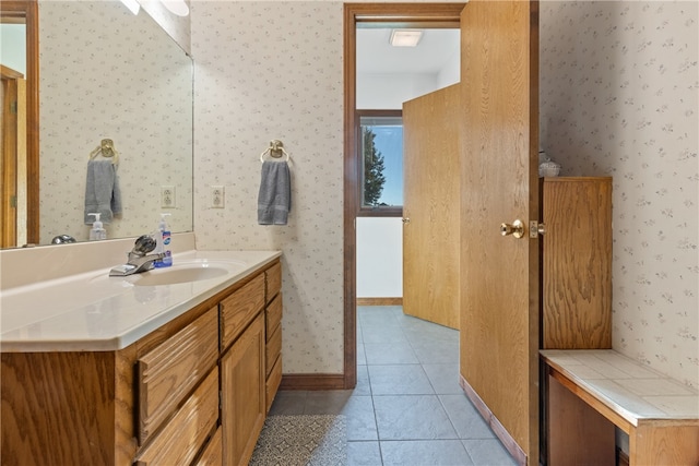 bathroom with tile patterned floors and vanity