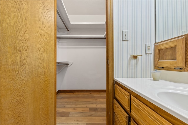 bathroom featuring wood-type flooring and vanity