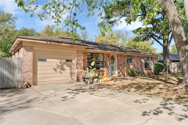 ranch-style house featuring a garage