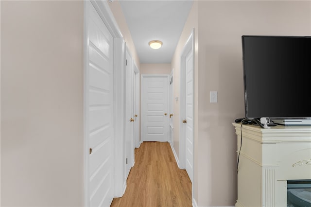 corridor featuring light wood-type flooring