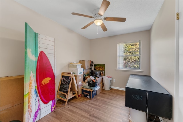 miscellaneous room featuring ceiling fan and light wood-type flooring