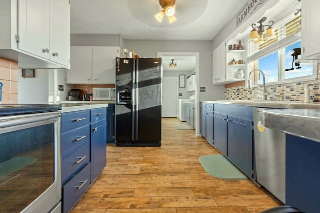 kitchen featuring white cabinets, blue cabinets, light hardwood / wood-style floors, and appliances with stainless steel finishes