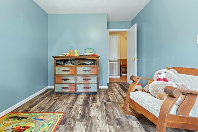 bedroom featuring dark hardwood / wood-style flooring