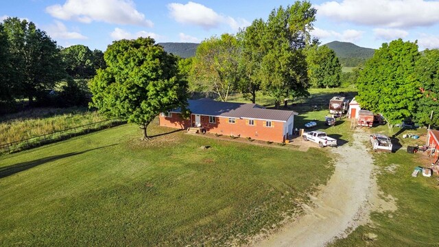 drone / aerial view featuring a mountain view