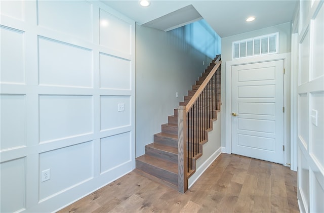 stairway with wood-type flooring