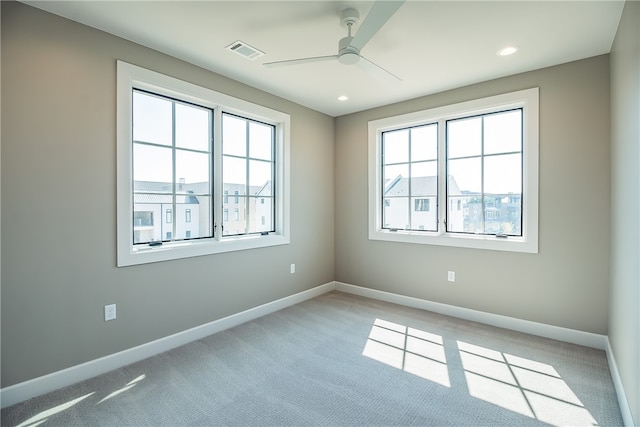 carpeted empty room with ceiling fan