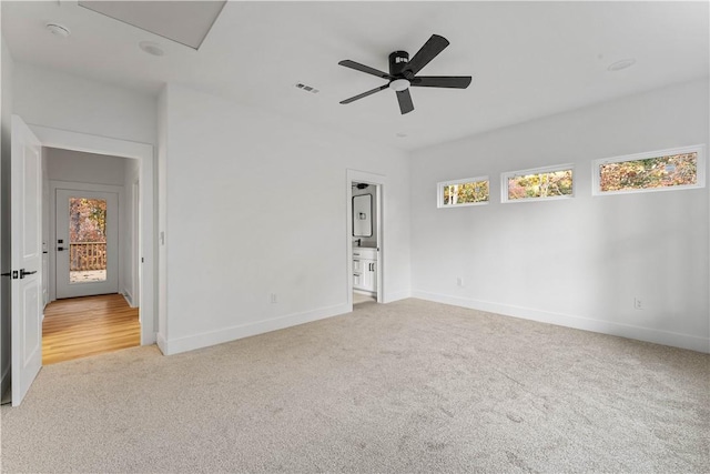 unfurnished bedroom featuring a ceiling fan, baseboards, visible vents, and carpet