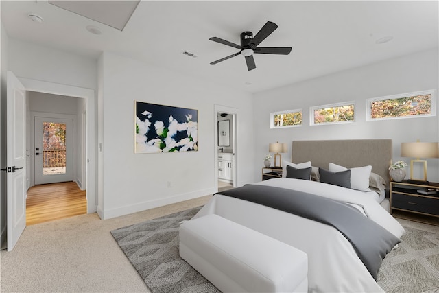 carpeted bedroom with connected bathroom, access to exterior, and ceiling fan