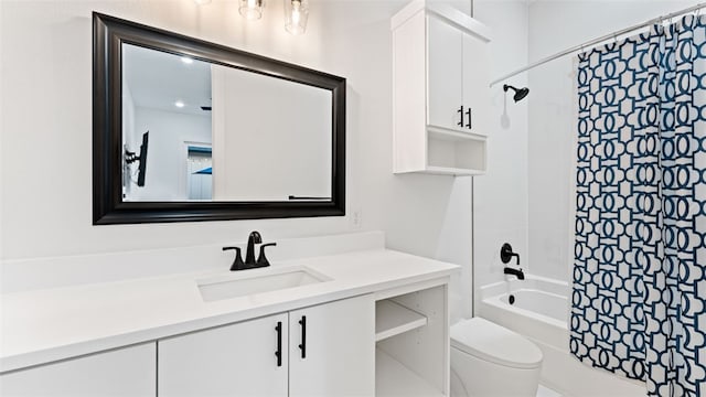 full bathroom featuring shower / bath combination with curtain, vanity, and toilet