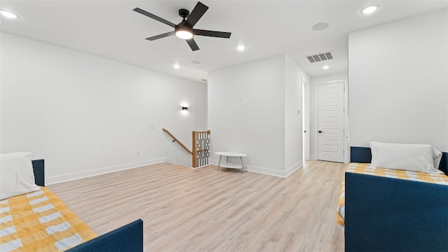 unfurnished room with light wood-type flooring and ceiling fan