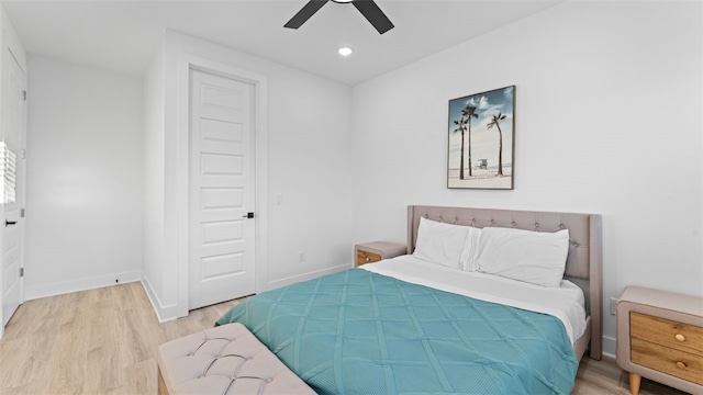 bedroom featuring a closet, wood-type flooring, and ceiling fan