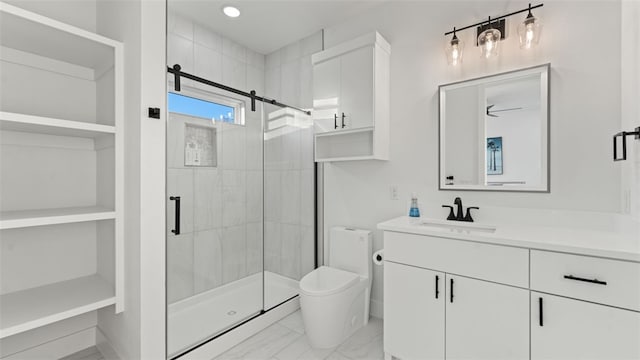 bathroom with an enclosed shower, vanity, and toilet