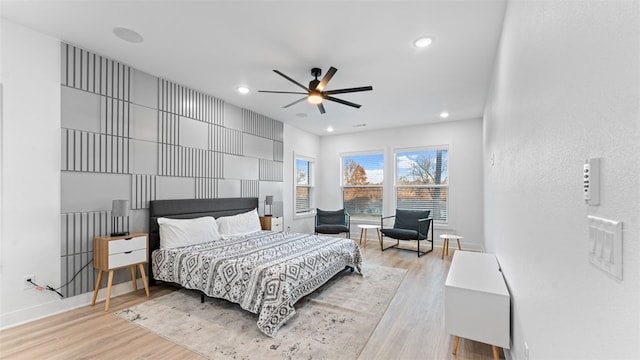 bedroom featuring light wood-type flooring and ceiling fan