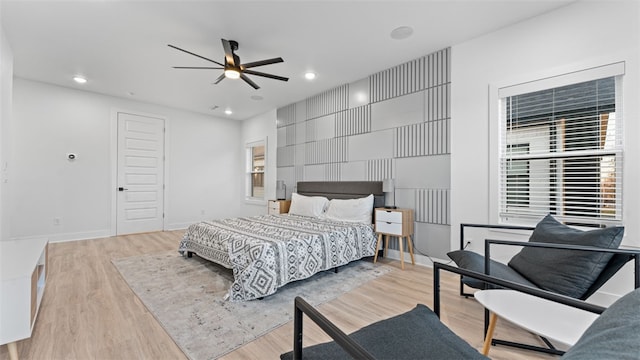 bedroom featuring light wood-type flooring and ceiling fan