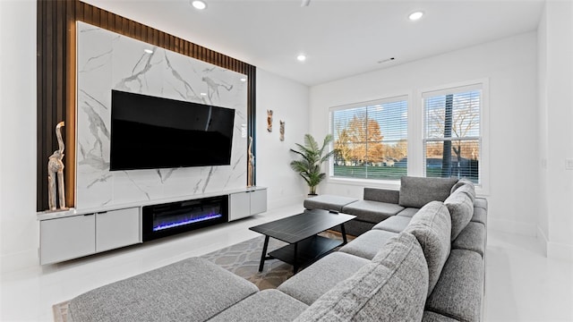 living room featuring a premium fireplace