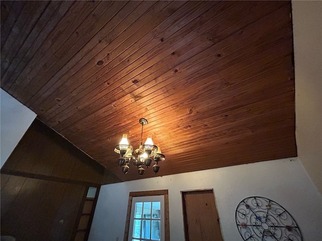 details with wooden ceiling and a notable chandelier