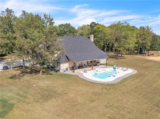 view of pool with a yard and a patio area