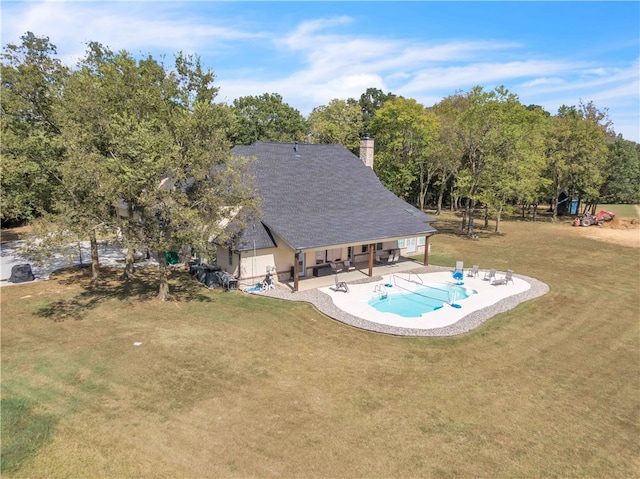 pool featuring a patio area and a yard