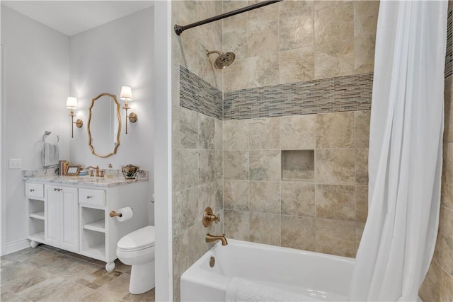 bathroom featuring shower / tub combo, toilet, vanity, and baseboards