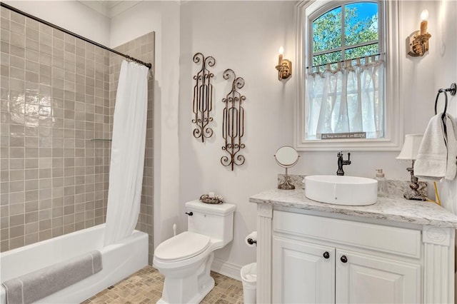 full bathroom with shower / tub combo, vanity, and toilet
