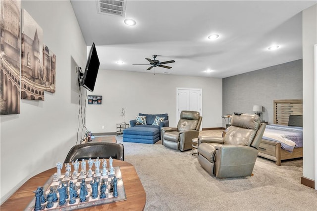 living area with visible vents, baseboards, ceiling fan, carpet, and recessed lighting