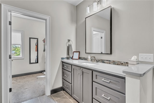 bathroom with tile patterned floors and vanity