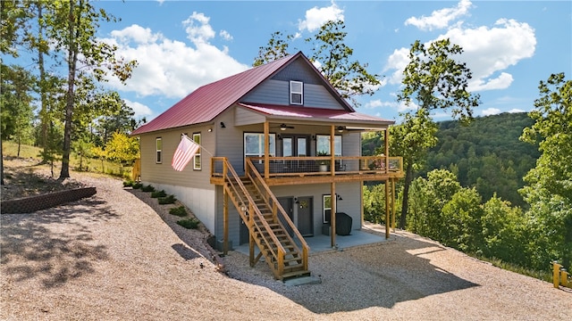 rear view of property with a patio area