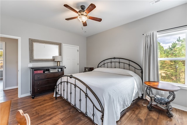 bedroom featuring ceiling fan and dark hardwood / wood-style flooring