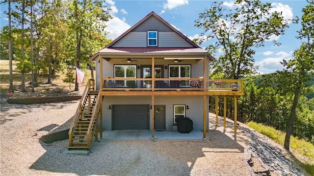 view of front facade with ceiling fan and a garage