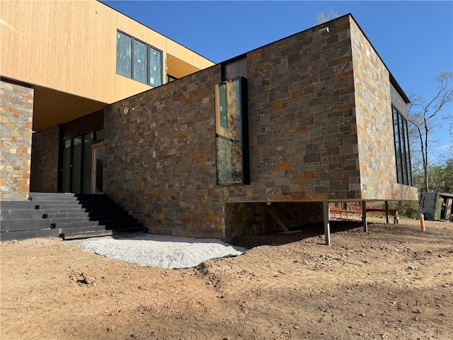 951 NW C St, Bentonville, AR 72712 - view of property exterior featuring stone siding