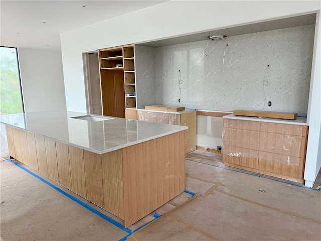951 NW C St, Bentonville, AR 72712 - kitchen with modern cabinets, light brown cabinets, and a spacious island
