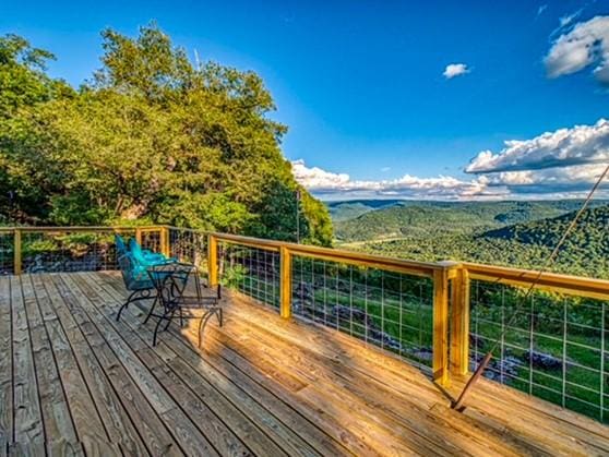 wooden deck featuring a mountain view